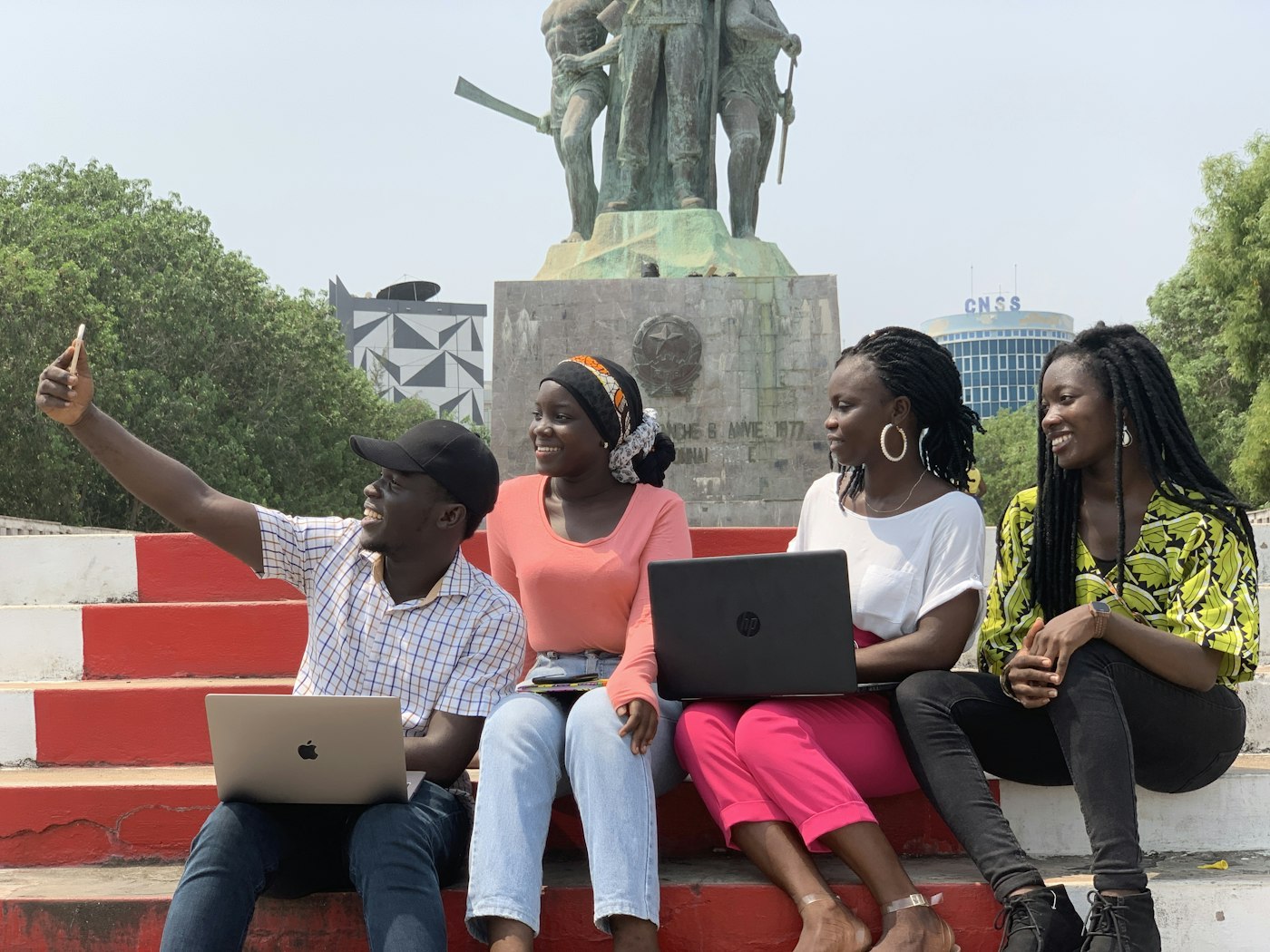 African students working together on laptops